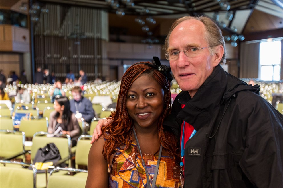 Peter Agre next to a young scientist at the 64th Meeting.