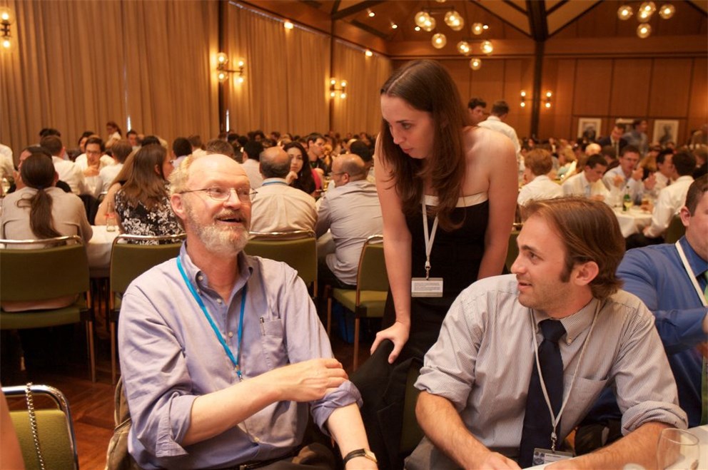 Robert Grubbs (Laureate, Chemistry 2005) in discussion with young researchers
