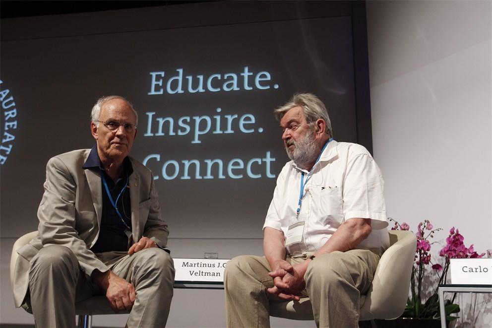 Laureates David Gross and Martinus Veltman discussing research results at the CERN panel discussion