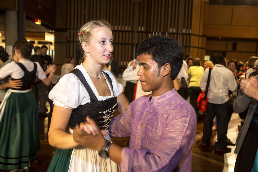 Young researchers in traditional attire of their home country at the Bavarian Evening.