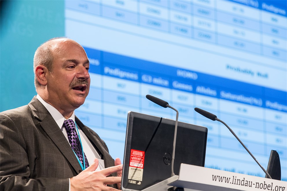 Bruce Beutler holding his lecture "Finding Mutations that Affect Immunity".