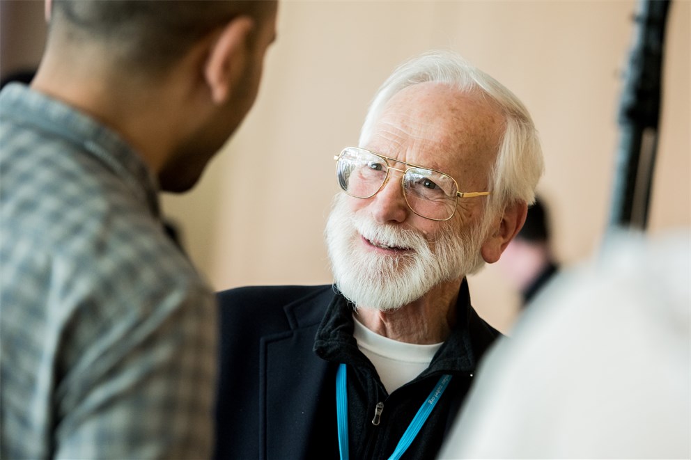 J. Michael Bishop talking to a young scientist at the 68th Lindau Nobel Laureate Meeting
