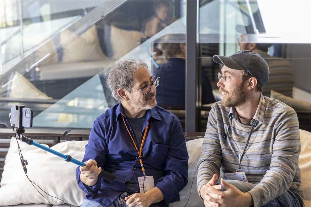 Brian Malow in conversation with a Young Economist on the boat trip to Mainau Island.